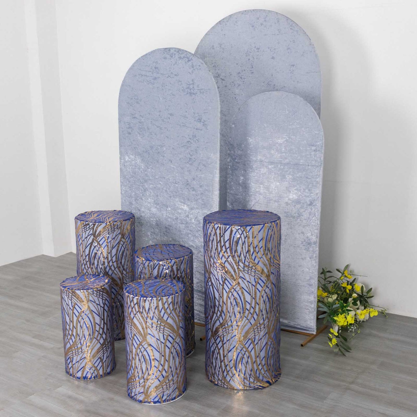Royal blue wave mesh cylinder pedestal stand covers with embroidered sequins.