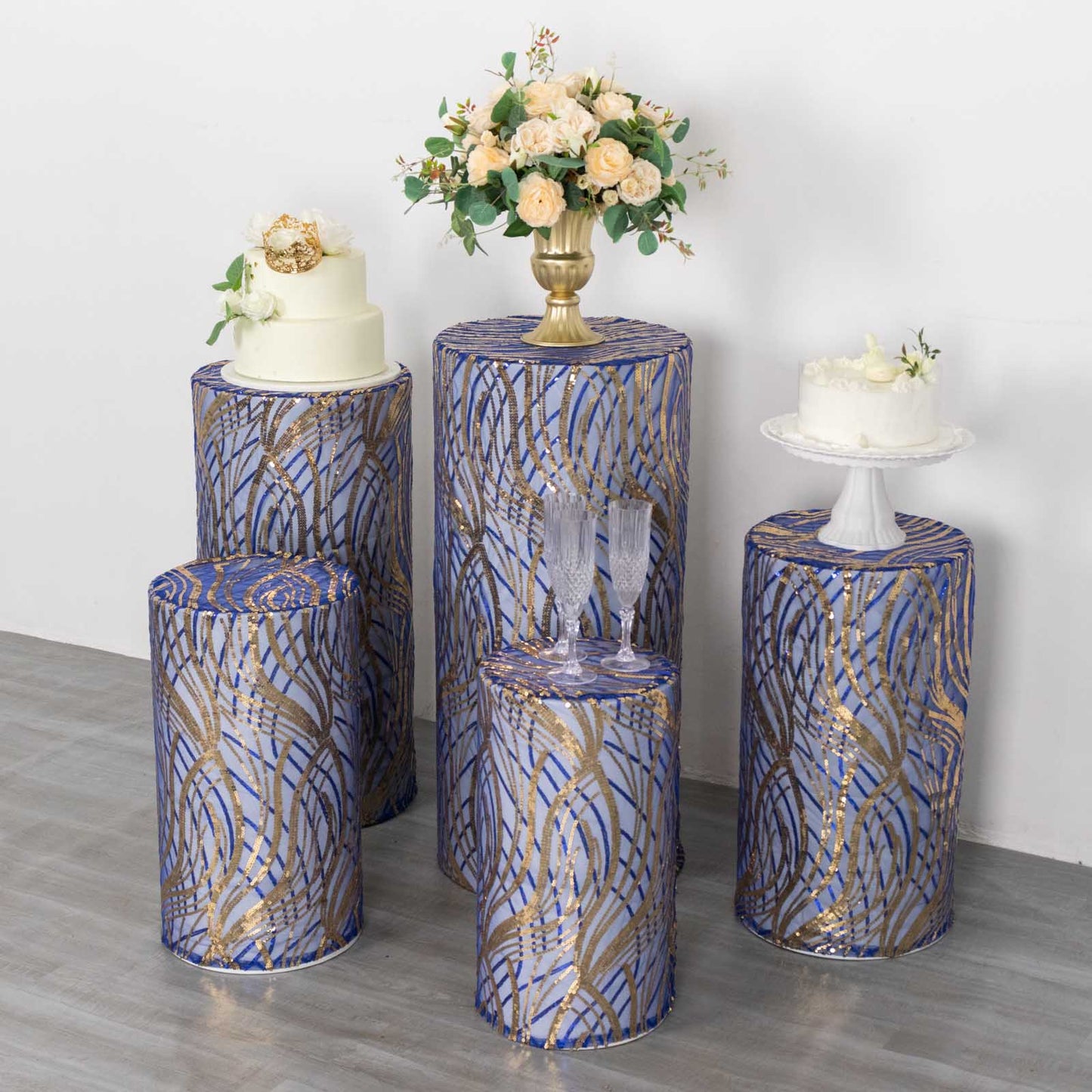 Royal blue wave mesh pedestal stand covers with embroidered sequins.