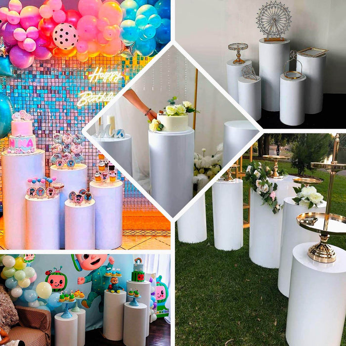 White metal cylinder pillar stands for wedding aisle display.