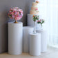 White metal cylinder pillar stands for wedding display, various heights.