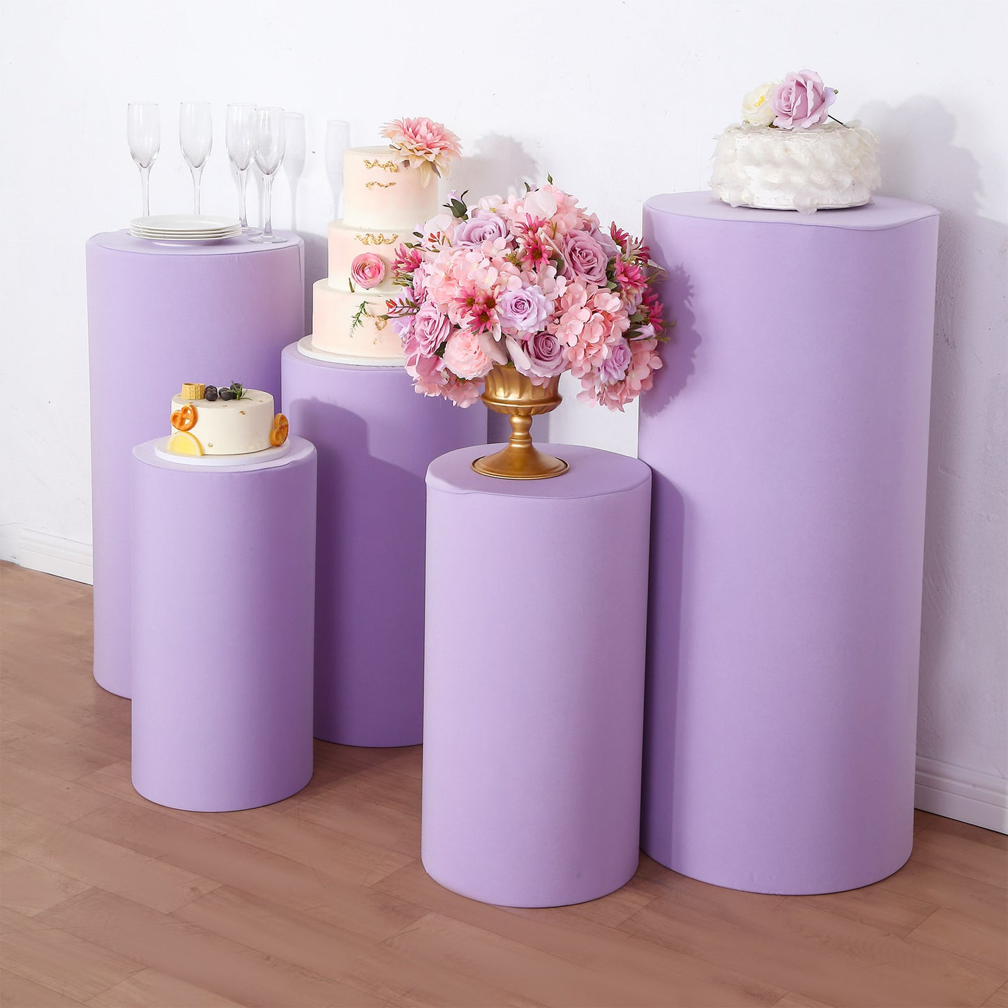 Set of 5 lavender spandex pedestal stand covers for event decoration.