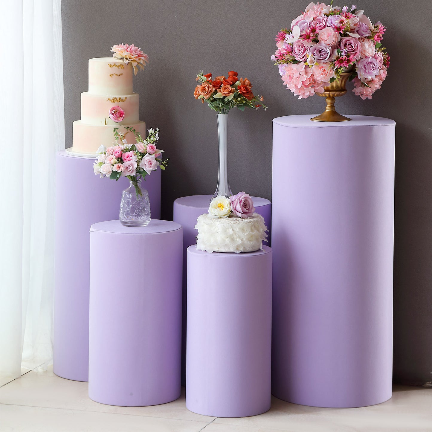 Lavender lilac spandex pedestal stand covers for events and displays.