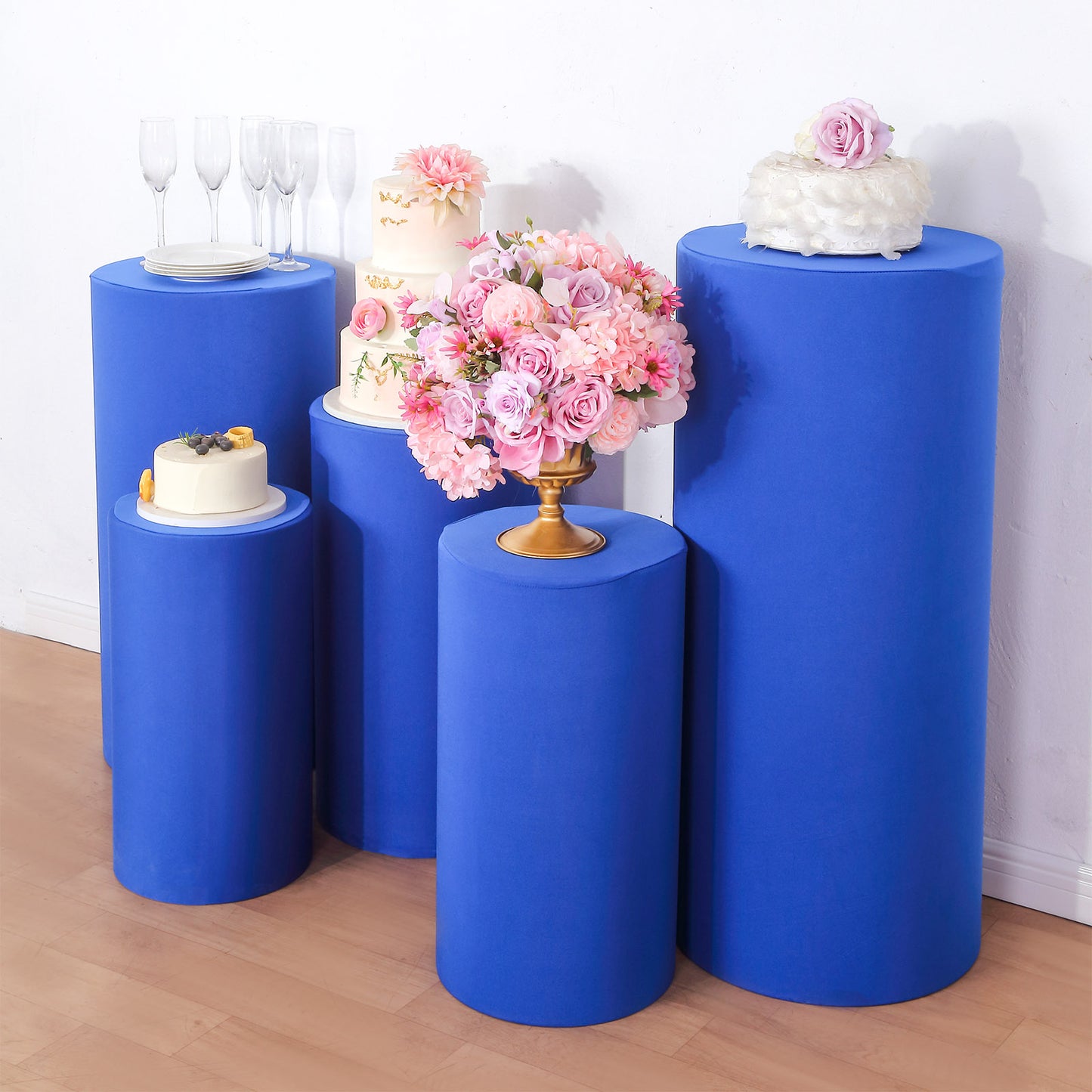 Royal blue spandex pedestal stand covers for events and decorations.