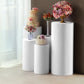 White spandex pedestal stand covers for events and displays.