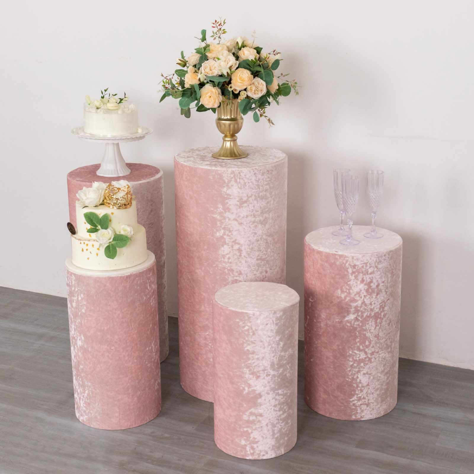Blush crushed velvet pedestal stand covers for elegant displays.