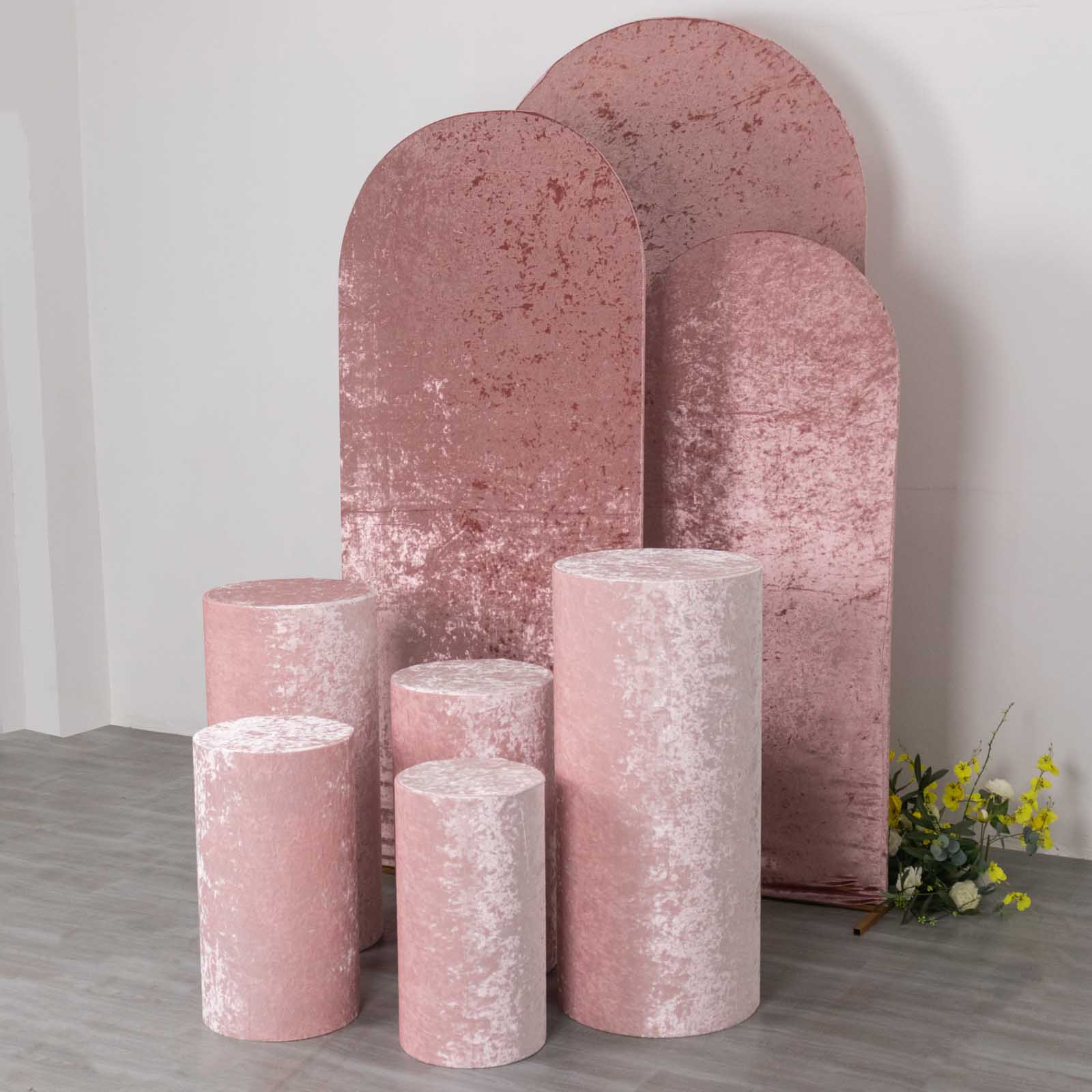 Blush crushed velvet pedestal stand covers for elegant decor displays.