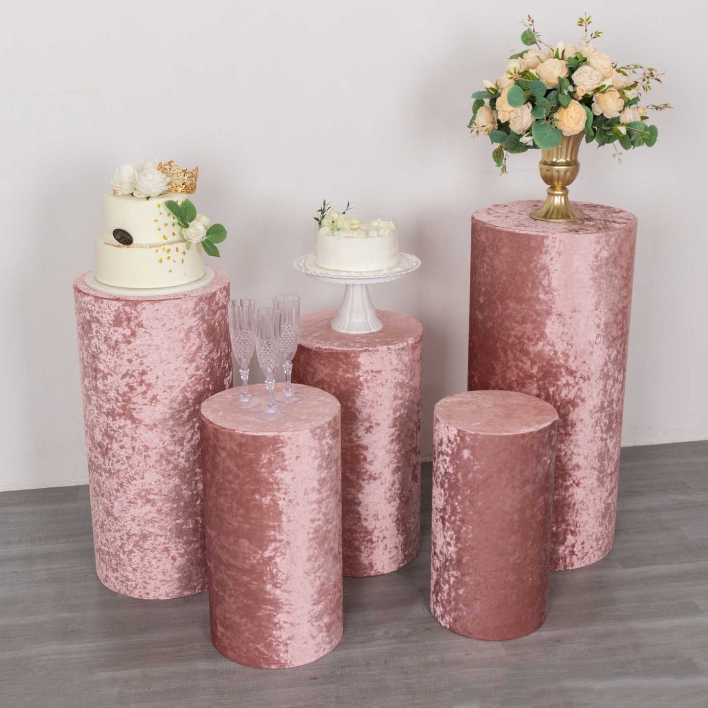 Dusty rose crushed velvet pedestal stand covers for elegant displays.