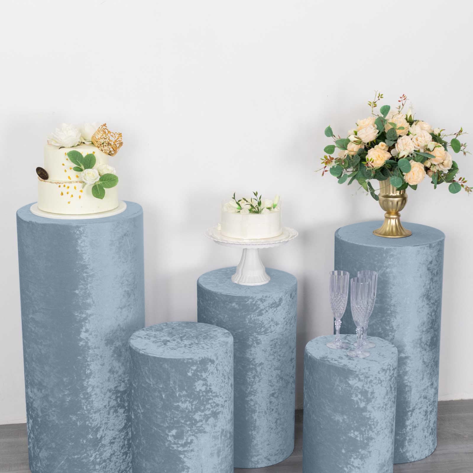 Dusty blue crushed velvet pedestal stand covers for decor and events.