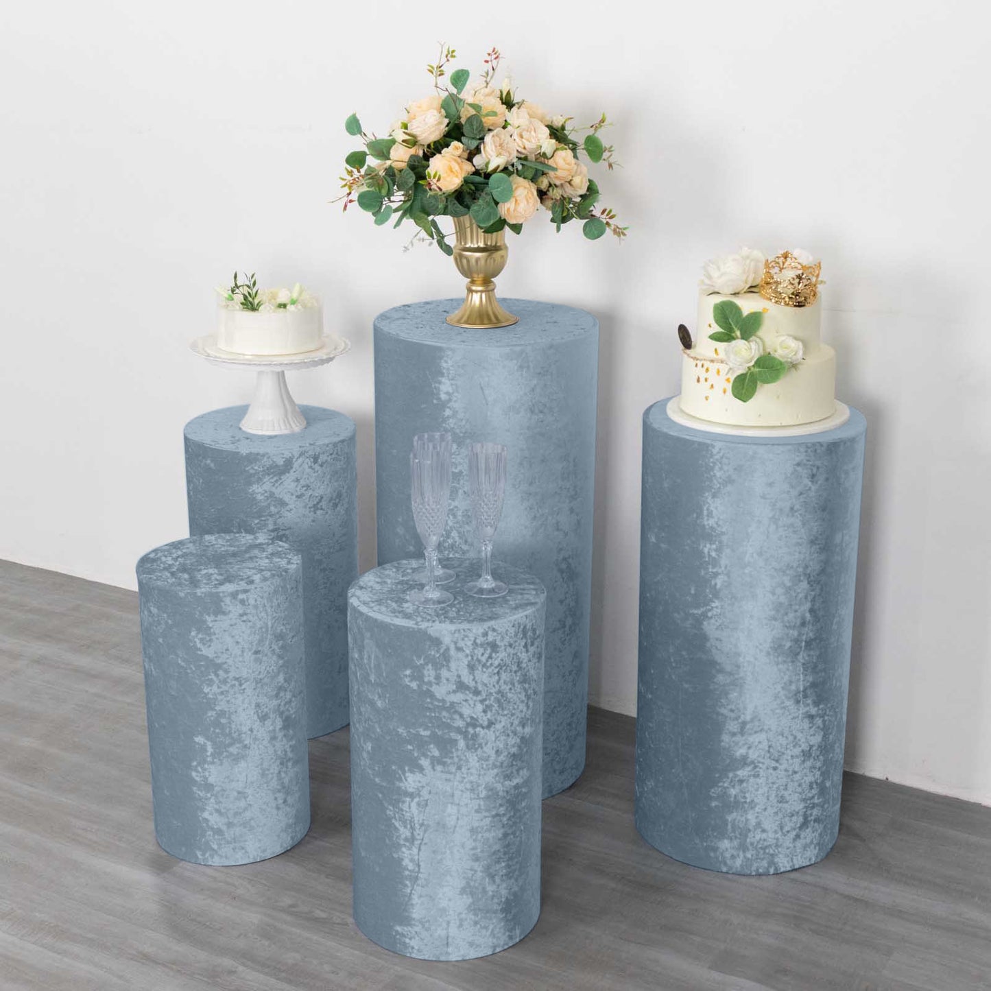 Dusty blue crushed velvet pedestal stand covers for elegant decor.