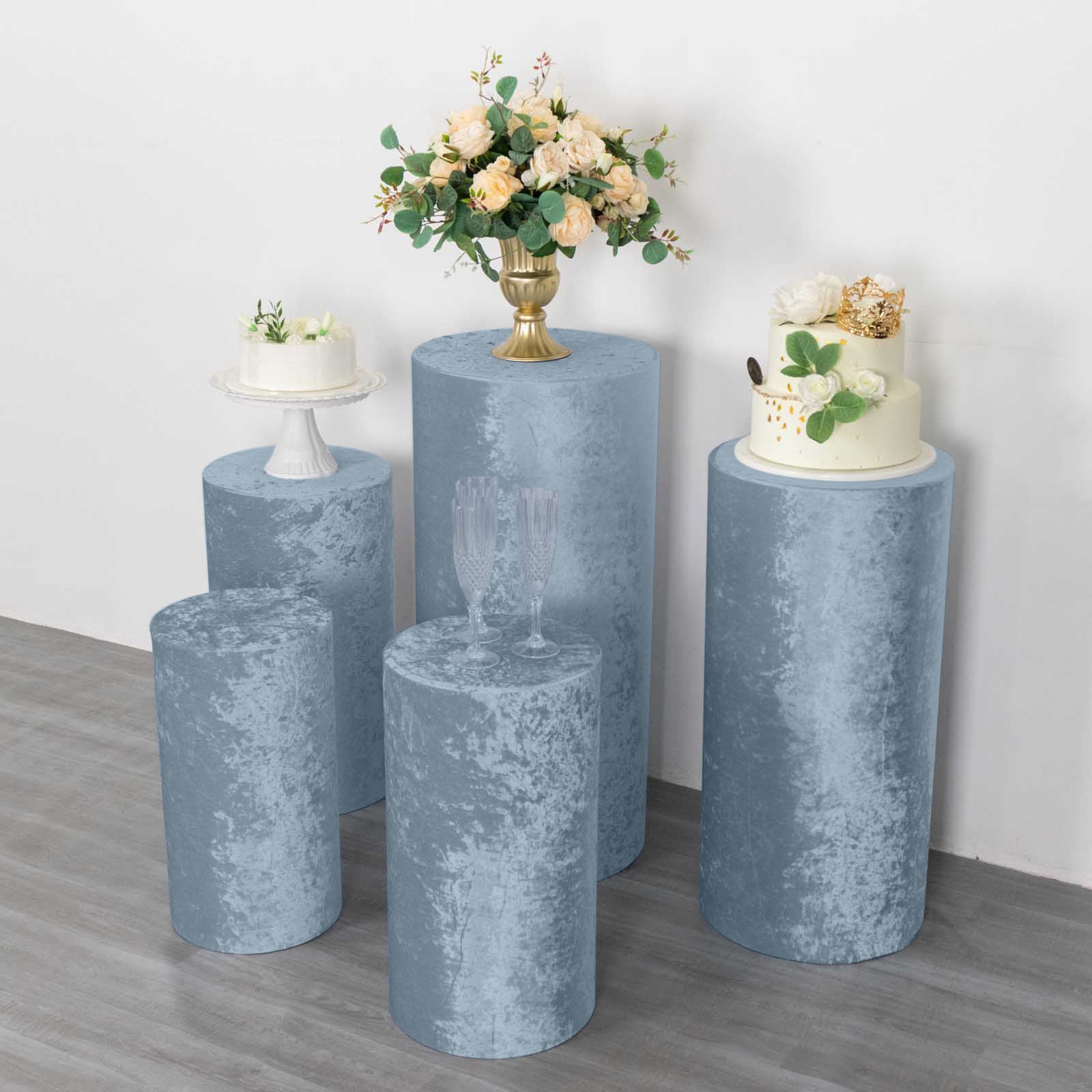 Dusty blue crushed velvet pedestal stand covers for elegant decor.