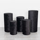 Set of 5 black crushed velvet pedestal stand covers.