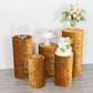 Gold velvet pedestal stand covers for elegant decor displays.