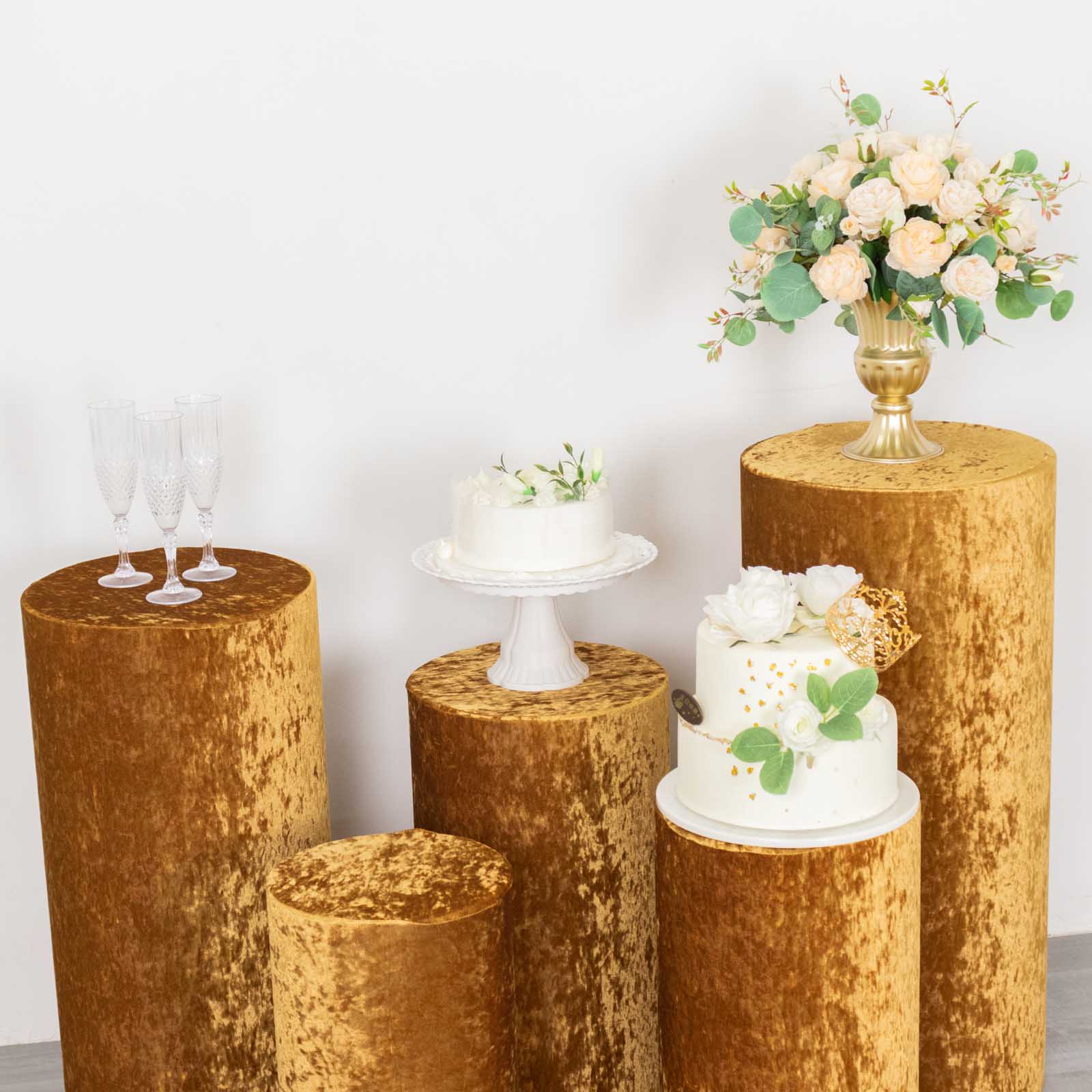 Gold crushed velvet pedestal stand covers for elegant displays.