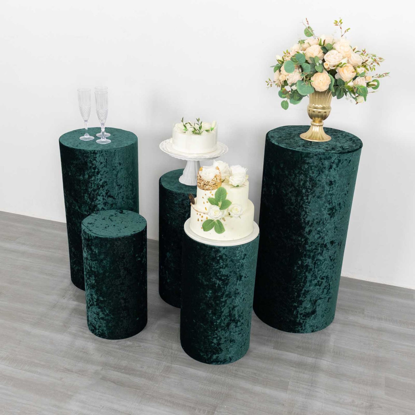 Hunter emerald green velvet pedestal stand covers for decorative displays.