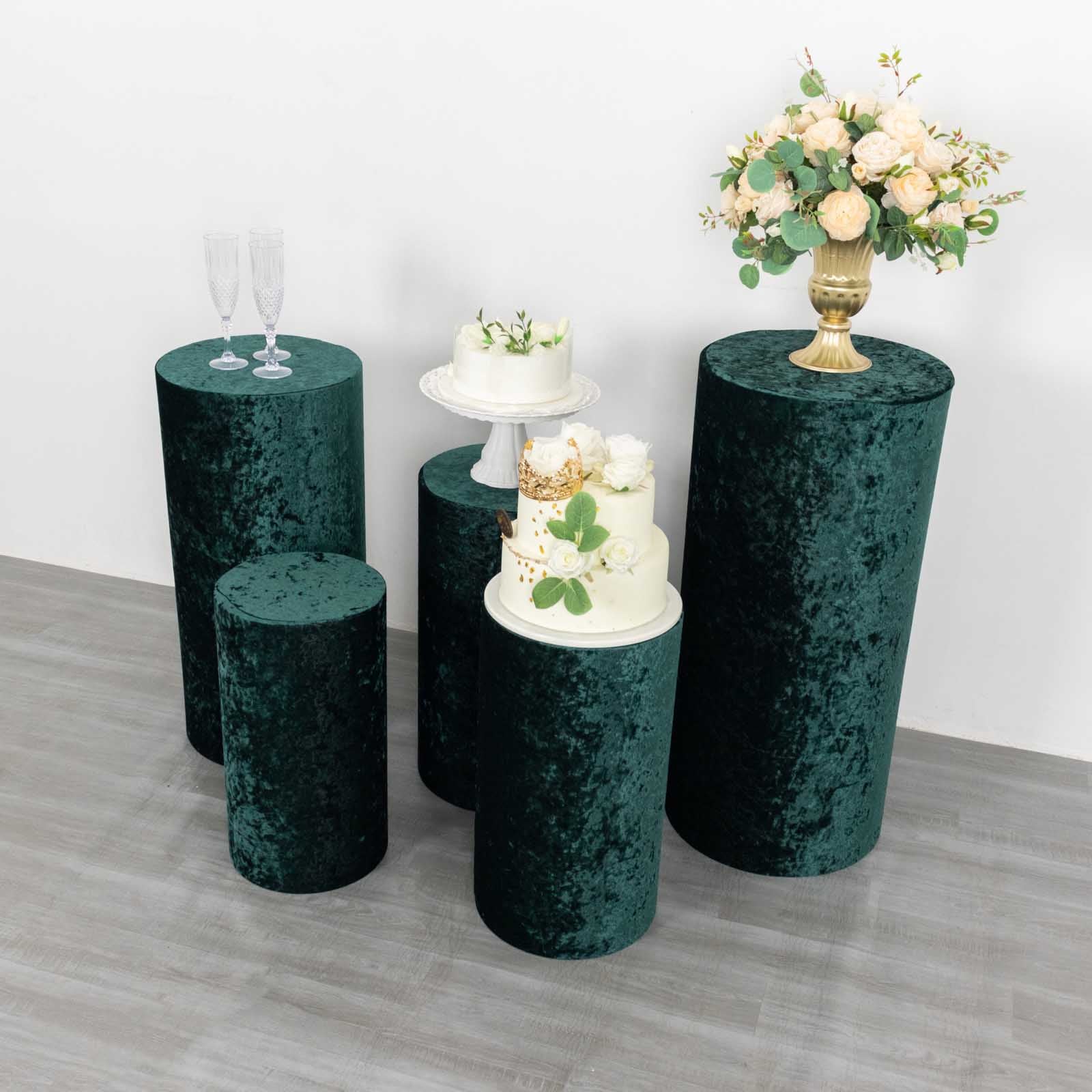 Hunter emerald green velvet pedestal stand covers for decorative displays.