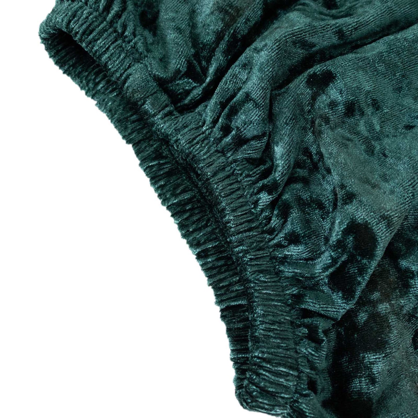 Emerald green crushed velvet pedestal stand cover detail.