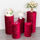 Set of 5 red crushed velvet pedestal stand covers for events and decorations.