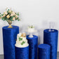 Royal blue crushed velvet pedestal stand covers set with floral and cake displays.