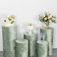 Sage green crushed velvet pedestal stand covers for elegant displays.