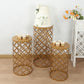 Gold metal cylinder cake display stands in hollow overlapping circles pattern.