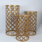 Gold metal cylinder cake display stands with round mesh pattern, set of three.