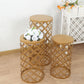Gold metal cylinder cake display stands in overlapping circles pattern.