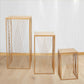 Gold metal rectangular plant stands with geometric pattern, nesting tables.
