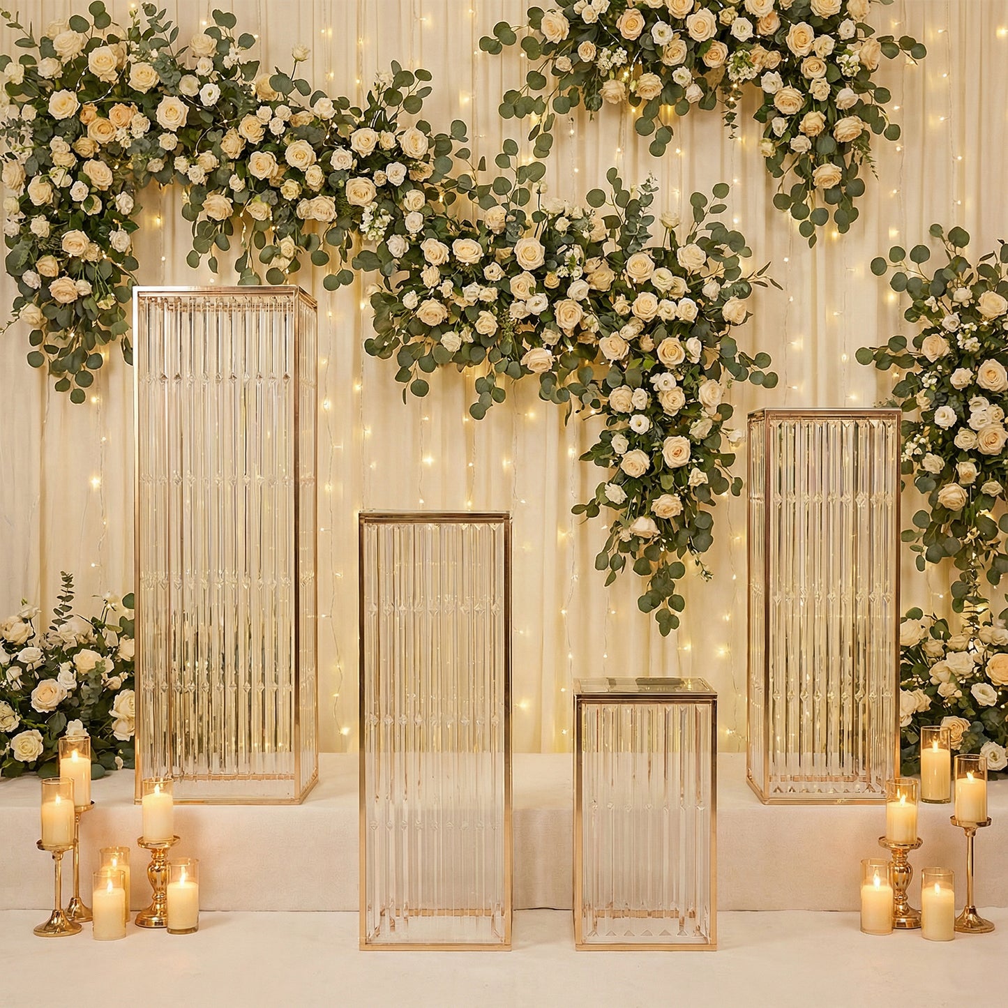 Gold metal pedestal stands with acrylic tops and crystal pendant chains.