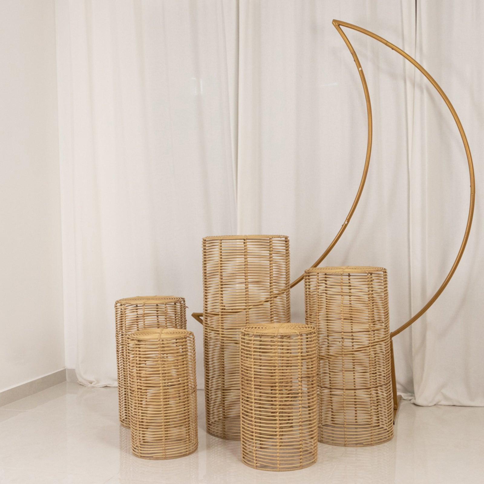 Natural woven rattan wicker pedestal stands in various heights.