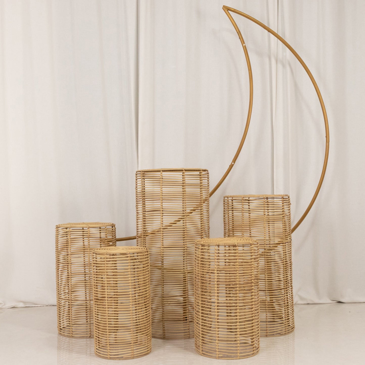 Natural woven rattan wicker pedestal stands in various heights.