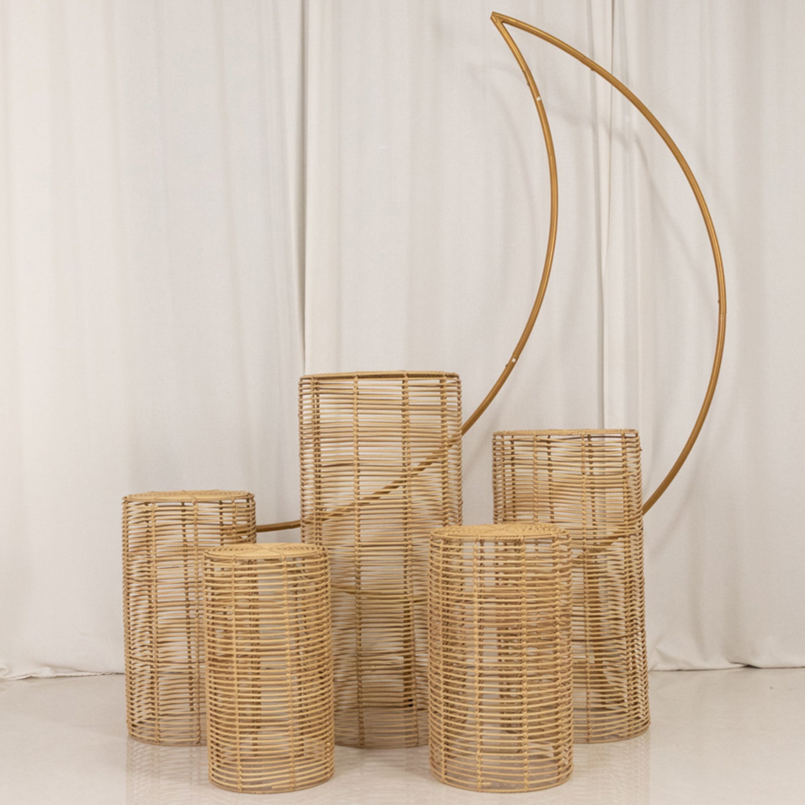 Natural woven rattan wicker pedestal stands in various heights.