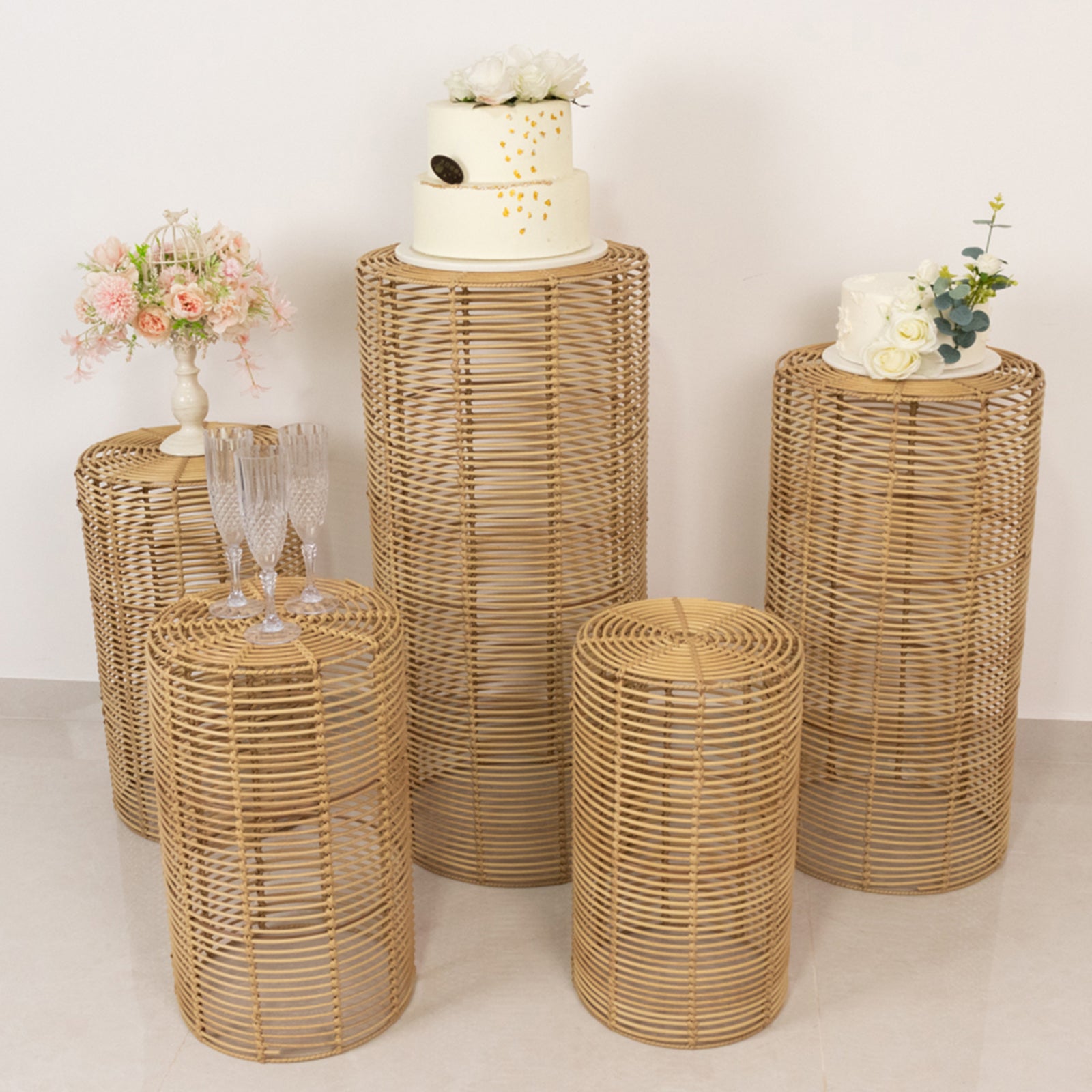 Natural woven rattan wicker pedestal stands in various heights, ideal for decor and displays.