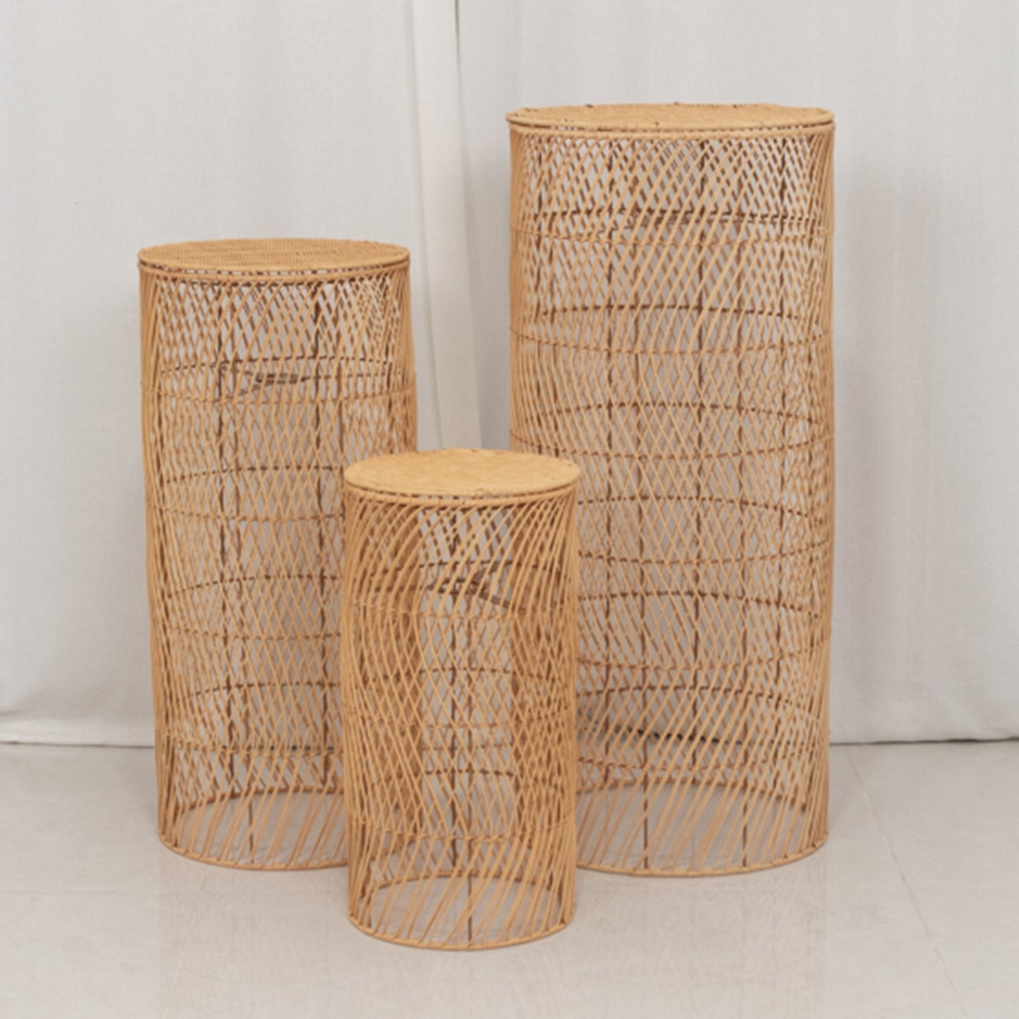 Natural woven rattan wicker pedestal stands in a rustic farmhouse style.