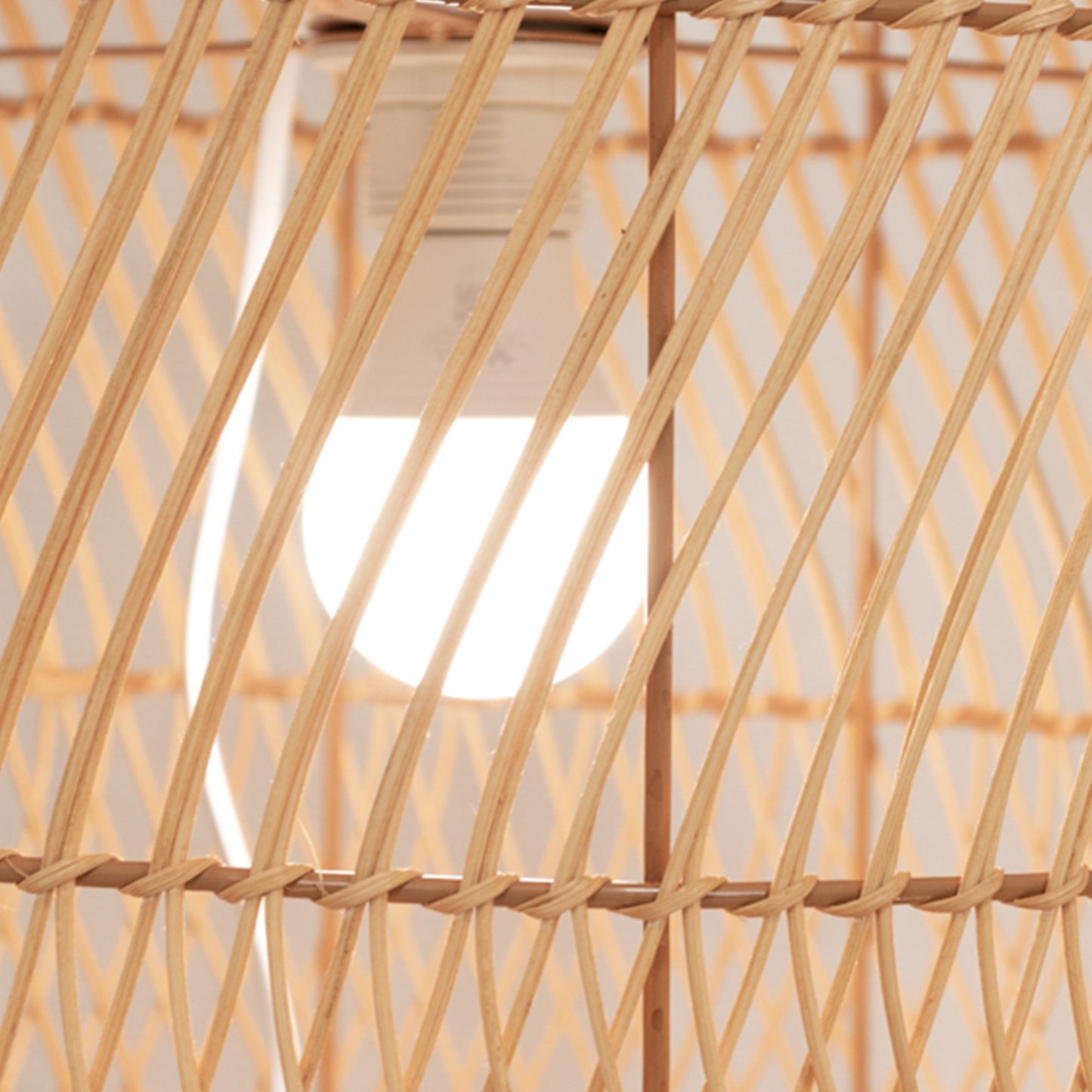 Natural woven rattan wicker lamp shade with wave pattern, rustic farmhouse style.