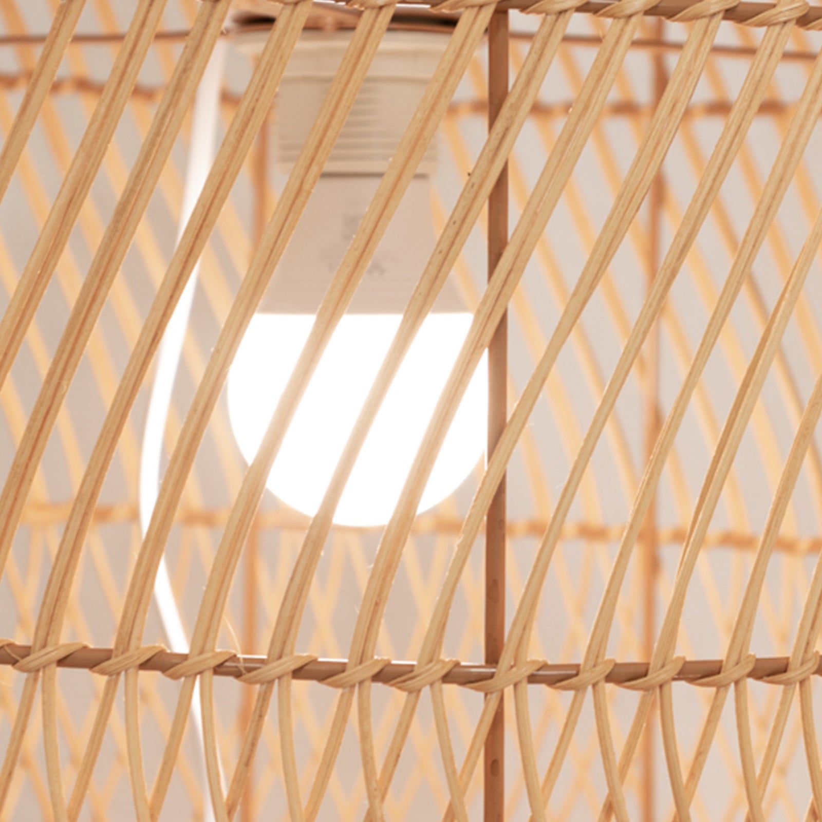 Natural woven rattan wicker lamp shade with wave pattern, rustic farmhouse style.