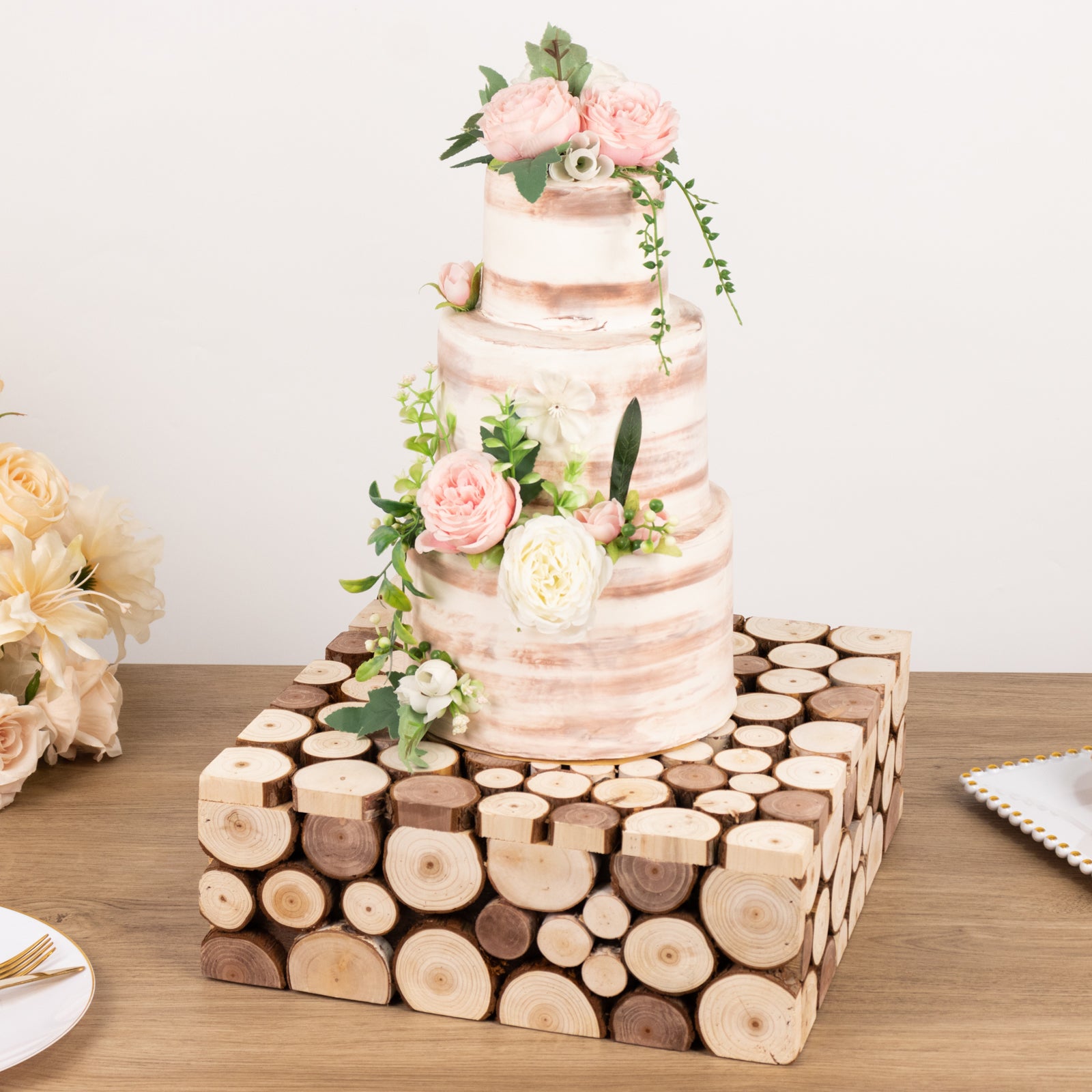 Natural wooden square display box pedestal riser with cake and flowers.