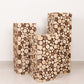 Natural wooden slices pillar pedestal stand, rustic farmhouse decor.