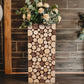 Natural wooden pillar stand with rustic slices, perfect for plant displays.