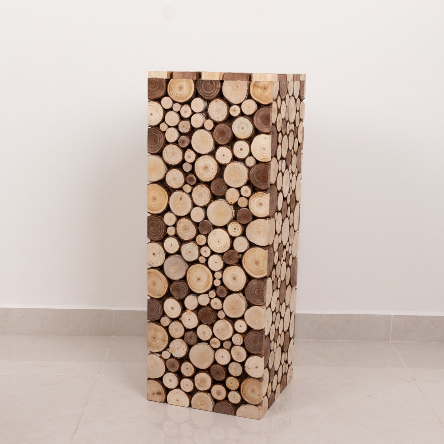 Natural wooden slices pedestal stand for rustic farmhouse decor.