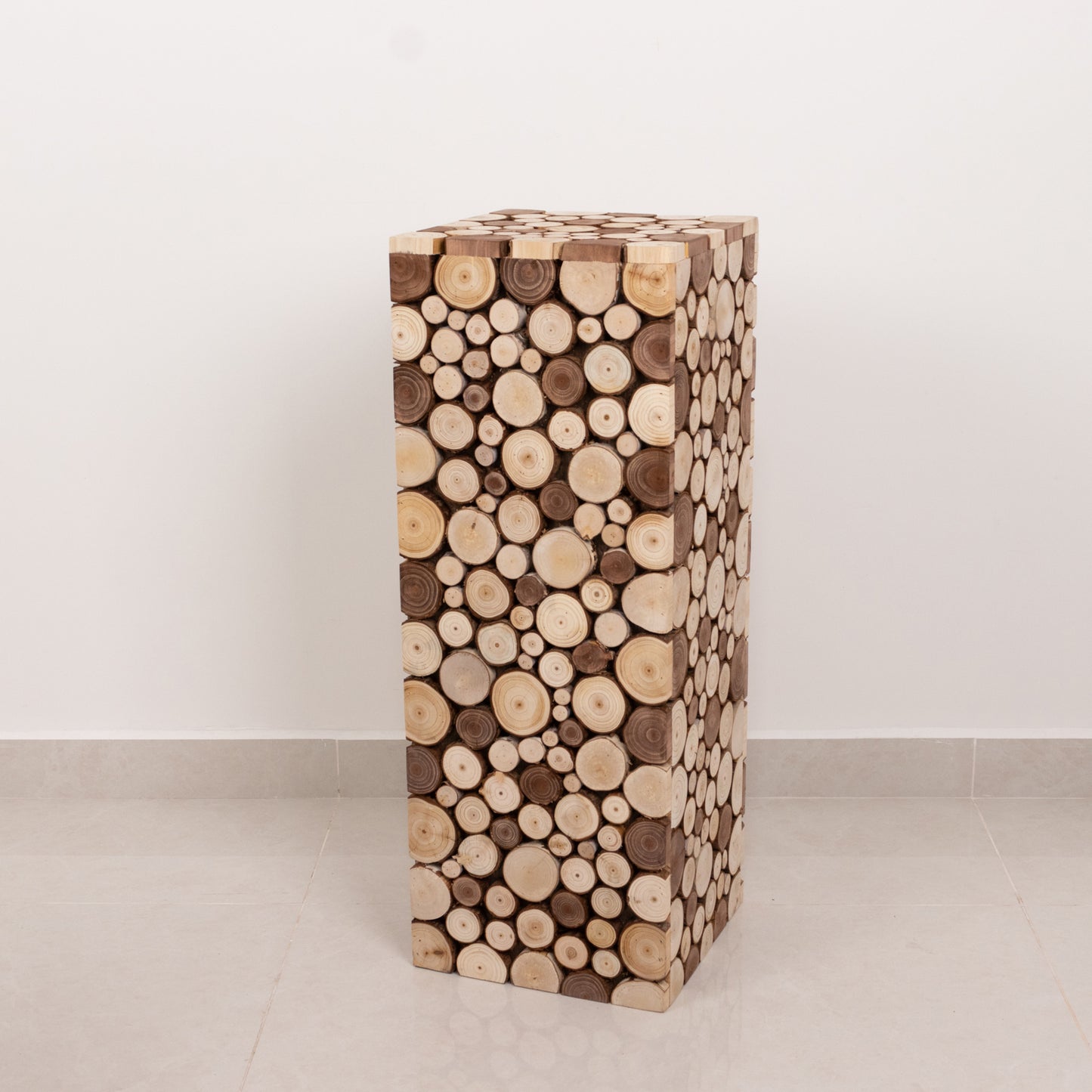 Natural wooden slices pillar prop pedestal stand in rustic farmhouse style.