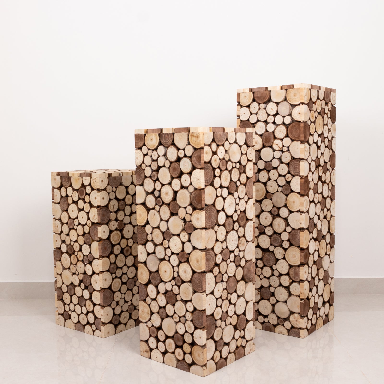 Natural wooden slices pillar stands in rustic farmhouse style.