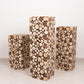 Natural wood pillar stands, rustic farmhouse decor for plants or displays.