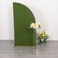 Clear acrylic flower pedestal stand with flowers, green background.