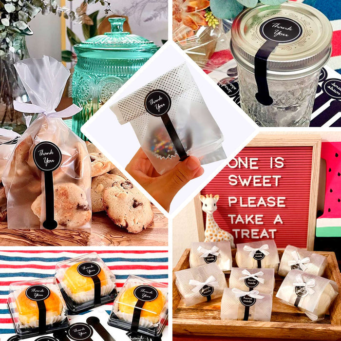 Clear black dotted gift bags with "Thank You" stickers for party favors.