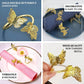 Gold butterfly metal napkin holder set for dining table decor.