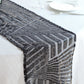 Black diamond glitz sequin table runner on a white table setting.