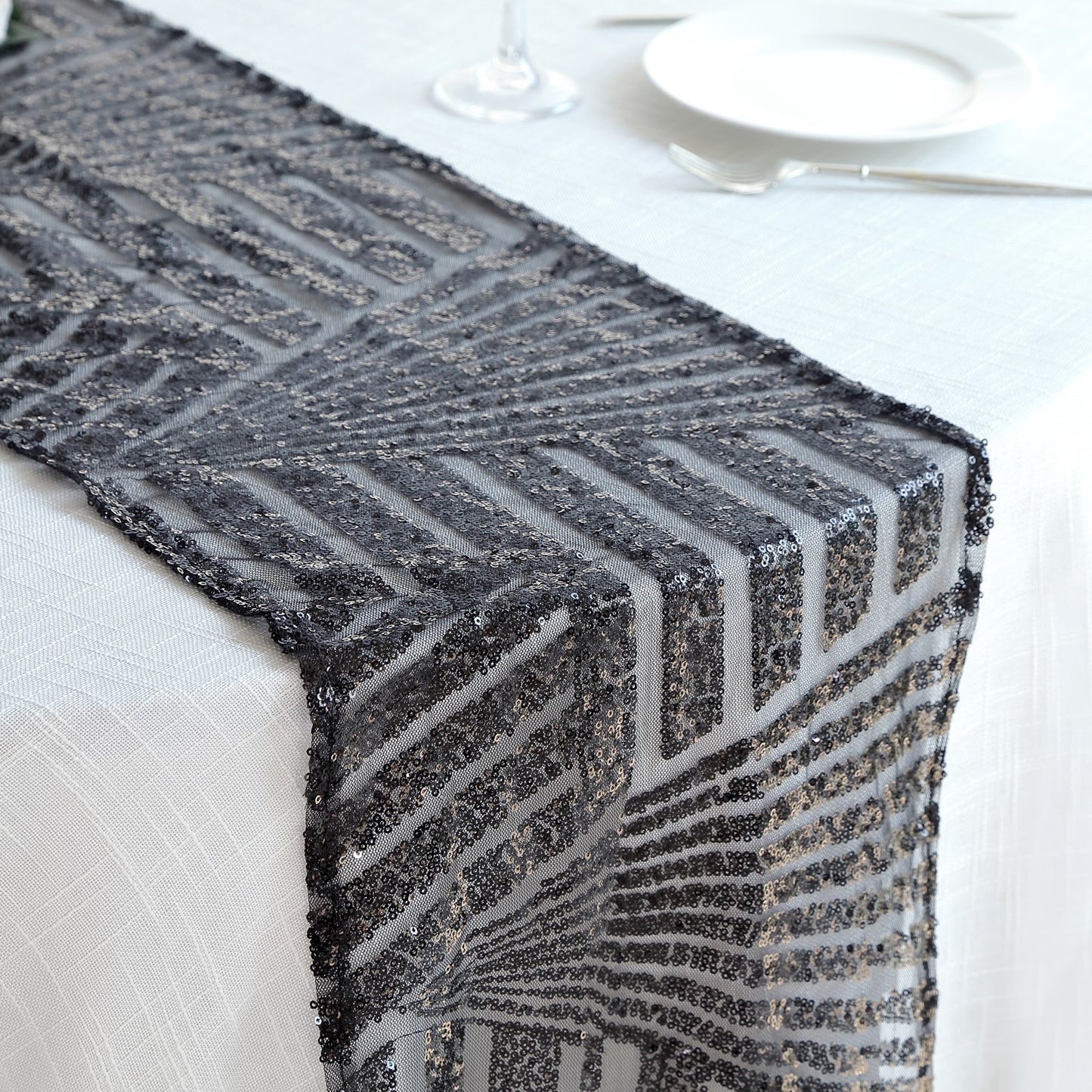 Black diamond glitz sequin table runner on a white table setting.