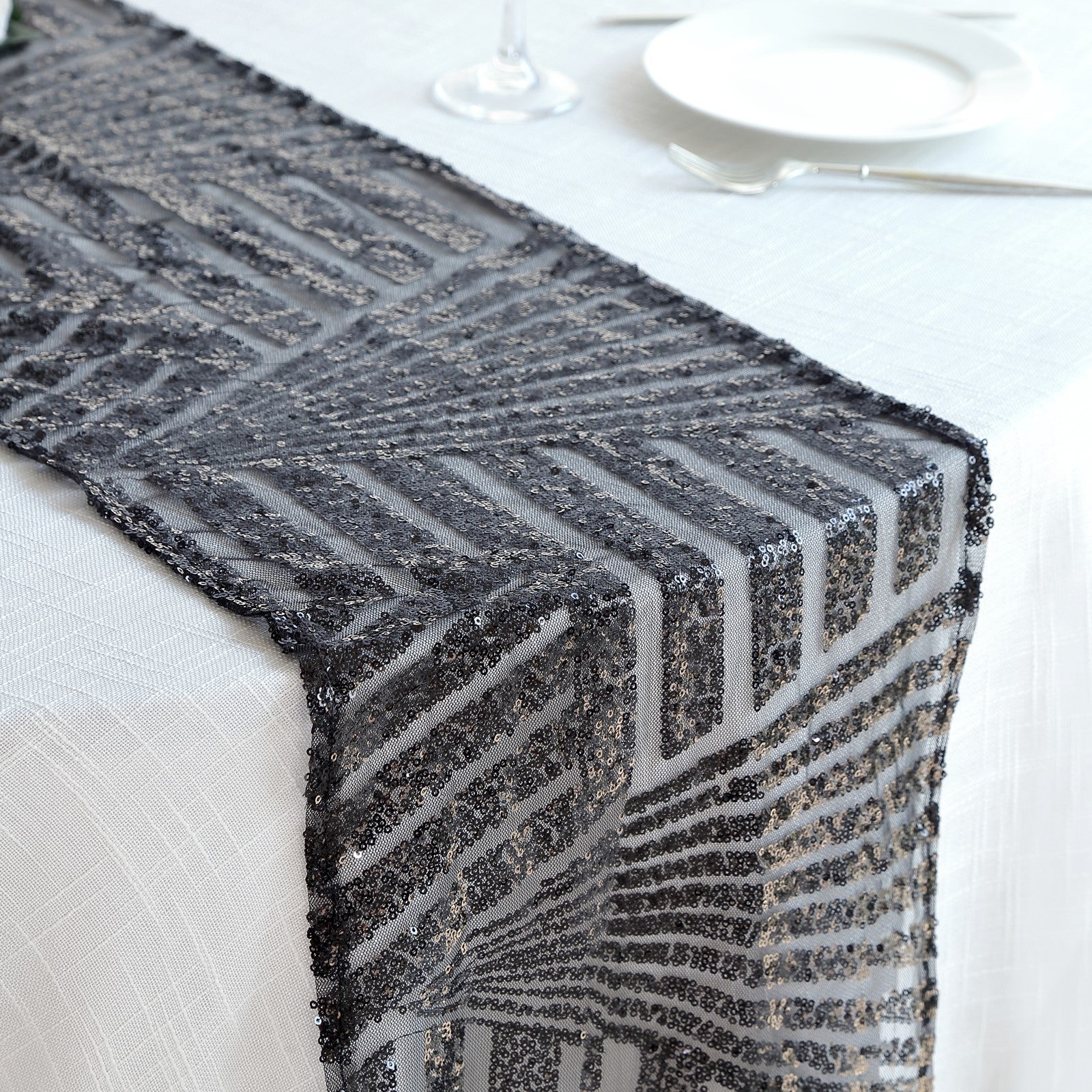 Black diamond glitz sequin table runner on a white table setting.