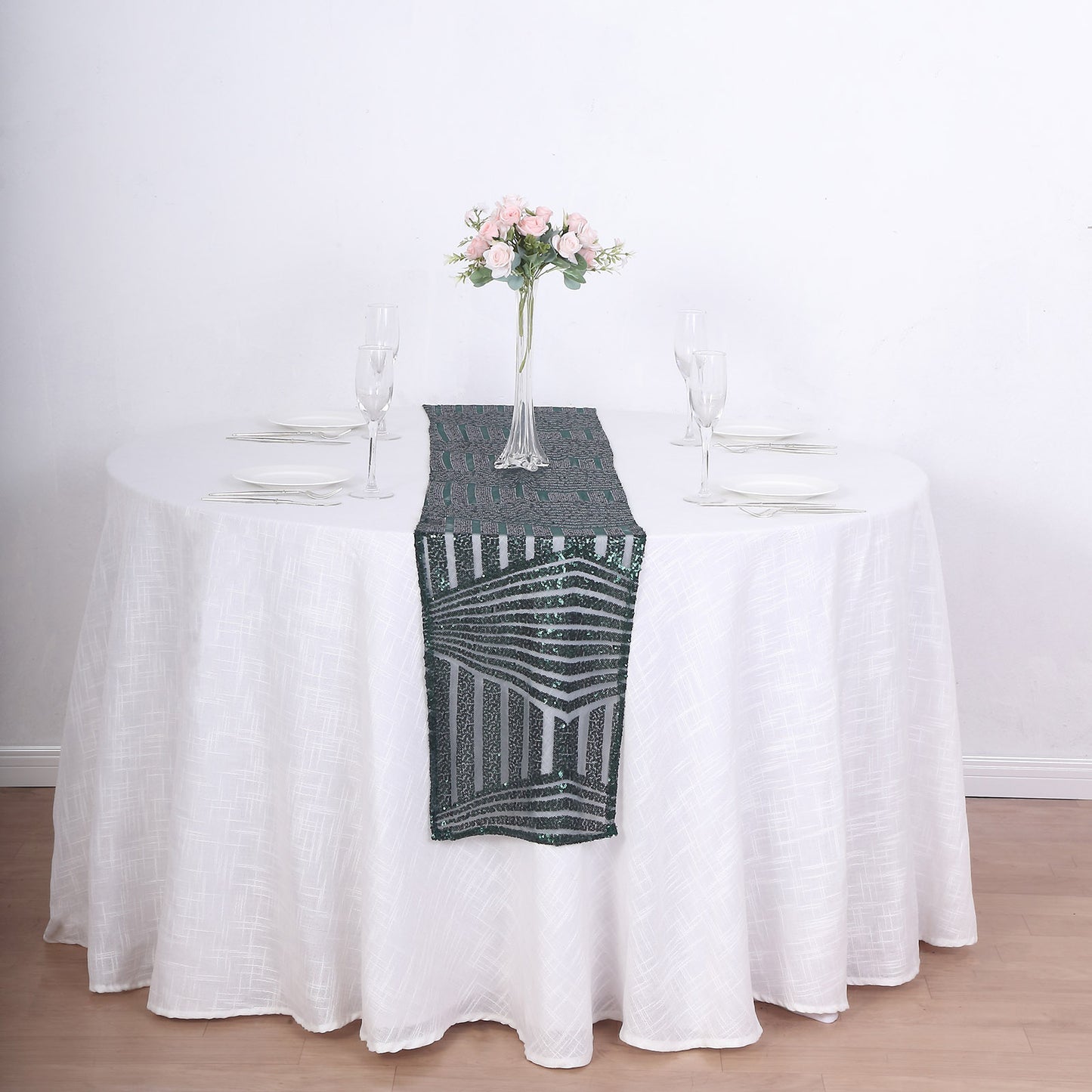 Hunter Emerald Green Sequin Table Runner on a round white table.