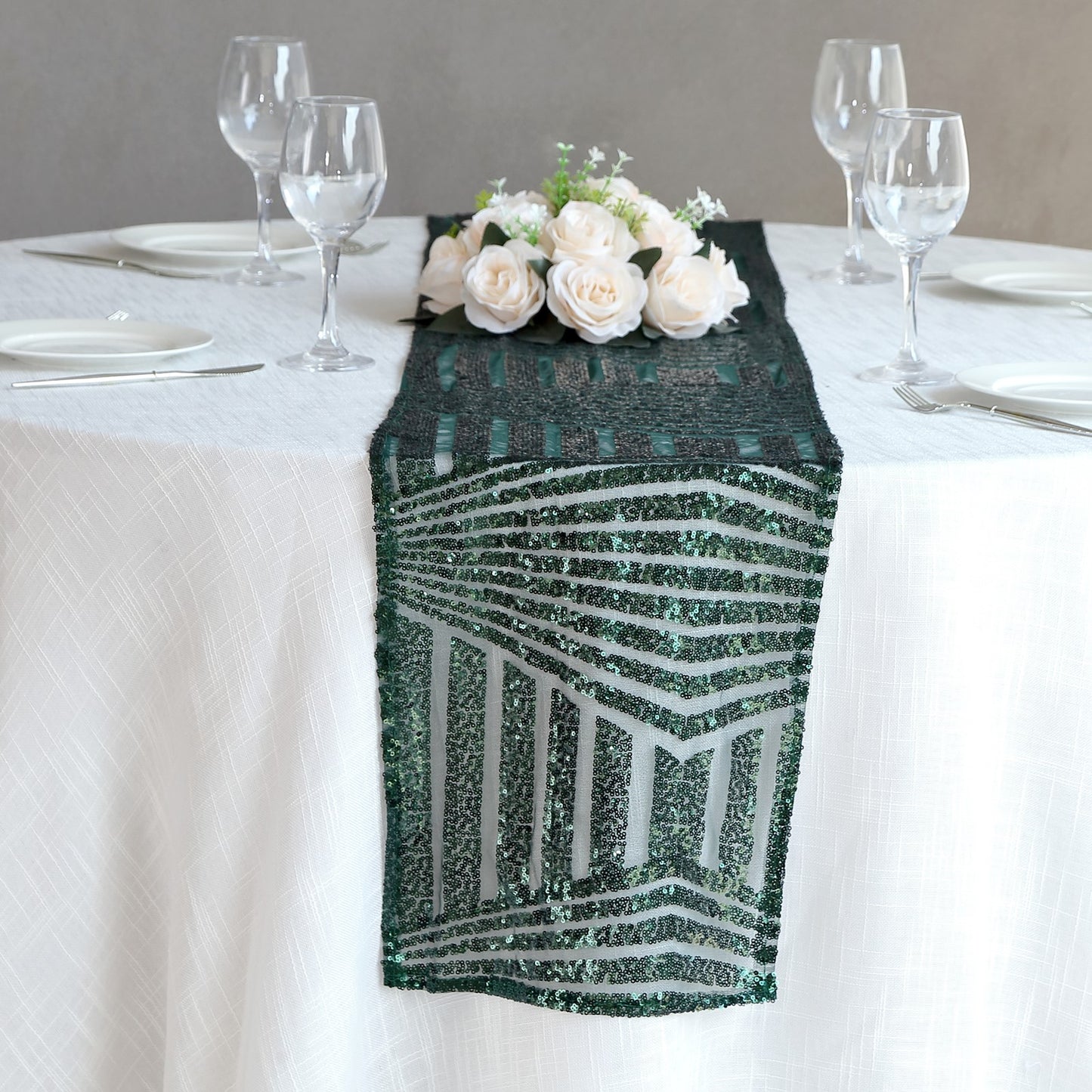 Hunter emerald green diamond glitz sequin table runner on a dining table.